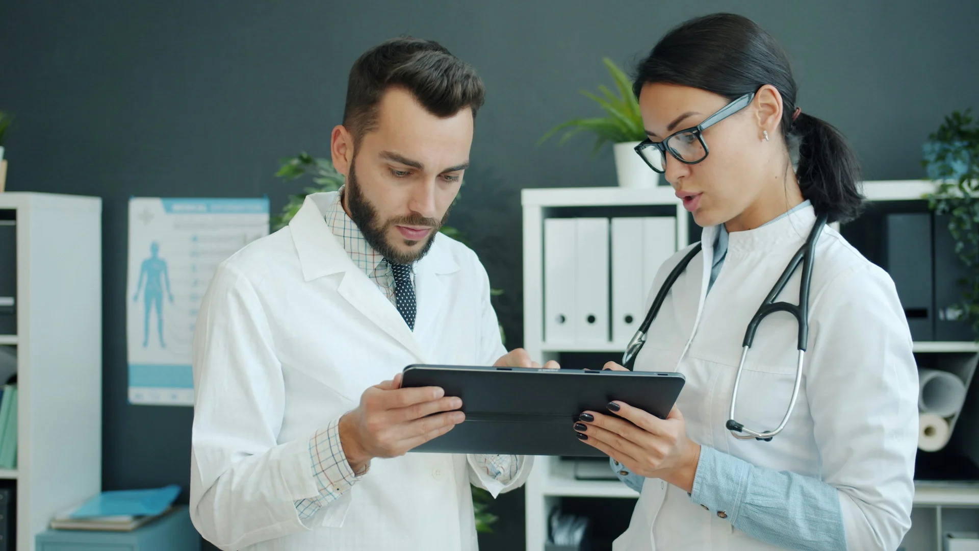 Healthcare innovation and collaboration - Medical professionals using digital technology for patient care